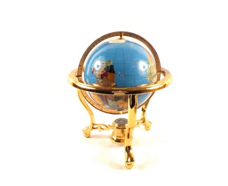 A decorative world globe on Brass gymbaled stand