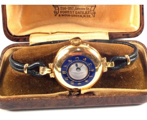 A 15ct Gold half Hunter wristwatch with blue enamel dial on leather strap