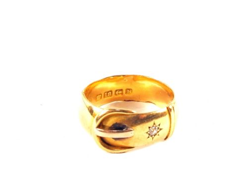 An 18ct Gold buckle ring set with small Diamond, size R