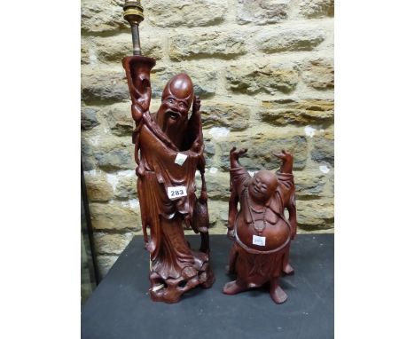 A CHINESE CARVED WOODEN FIGURE OF SHOULAO AS A LAMP, HE STANDS BY A CRANE OPENING A SCROLL.   H 43cms. TOGETHER WITH A HARDWO