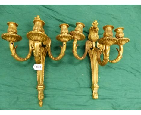 A PAIR OF GILT BRONZE THREE BRANCH WALL LIGHTS, THE NOZZLES CAST WITH FOLIAGE AND THE BACK PLATES TOPPED BY FLOWER BUDS.   H 