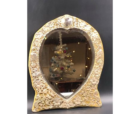 AN ANTIQUE VICTORIAN HEART SHAPED SILVER FRAMED AND WOODEN EASEL BACKED DRESSING TABLE MIRROR. THE SILVER BORDER WITH A PIERC