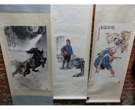 A CHINESE SCROLL PAINTING OF A SOLDIER PUSHING A HORSE AWAY FROM AN APPROACHING TRAIN.   99.5 x 55cms. ANOTHER OF A LADY PARA