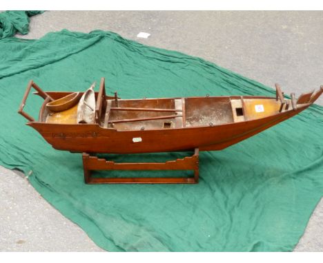 A MAHOGANY SCALE MODEL OF A CHINESE SAILING JUNK ON WOOD STAND.   W 84cms.