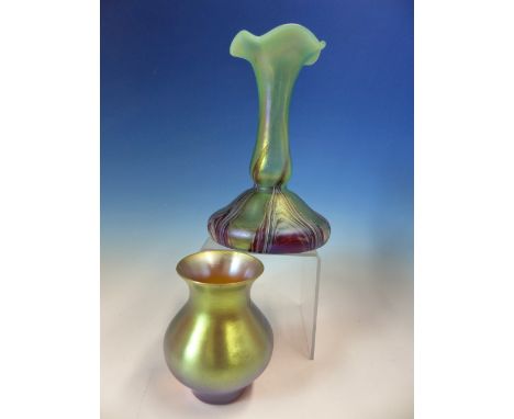 AN IRIDESCENT GLASS BALUSTER VASE, POSSIBLY WMF, THE AMBER GLASS WITH A GOLDEN GLOW.   H 10.5cms. TOGETHER WITH A LOETZ STYLE