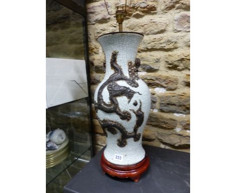 A CHINESE CRACKLEWARE BALUSTER VASE AS A LAMP WITH TWO BRONZED DRAGONS ON ONE SIDE OF THE CHERRY BLOSSOM HANDLES AND A CRANE 