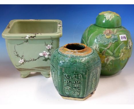 A CHINESE GREEN GROUND JAR AND COVER MOULDED IN RELIEF AND PAINTED WITH A CRANE AMONGST LOTUS.   H 25cms. A GREEN GROUND HEXA