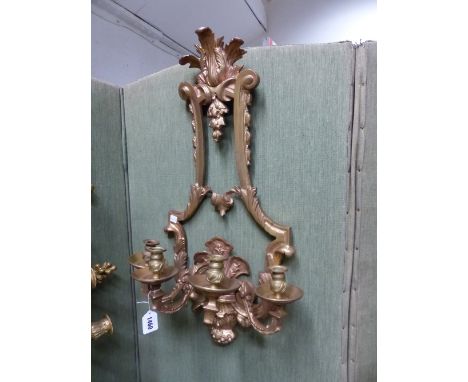 A PAIR OF FRENCH STYLE GILT BRONZE FOUR BRANCH WALL LIGHTS, THE NOZZLES ON ARMS SCROLLING BAROQUE BACKPLATES RISING UP ON TWO