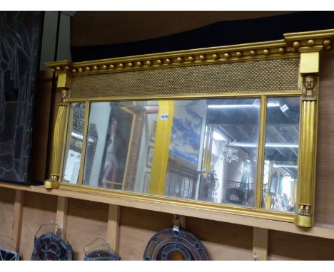 A 19th.C. THREE PLATE MIRROR WITH GILT BEADED CORNICE ABOVE FISH SCALE BAND AND PHAROAH PILASTERS.   W 116 x 57cms.