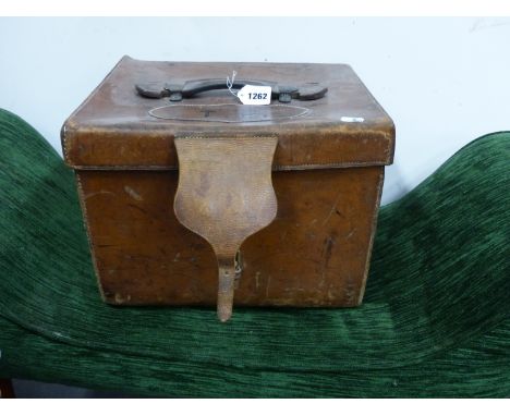 AN ARMY AND NAVY LEATHER HAT BOX LINED IN RED SCRIM.   W 37.5 x D 31 x H 27cms.