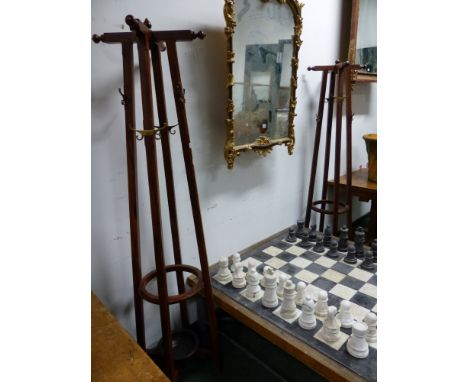 A PAIR OF ROSEWOOD HALL STANDS, EACH OF THE CRUCIFORM HAT PEG TOPS TO FOUR COLUMNS MOUNTED WITH PAIRS OF BRASS CLOTHES HOOKS 