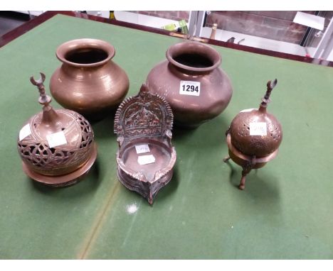 TWO ISLAMIC BRASS ONION TOPPED INCENSE BURNERS AND STANDS, AN INDIAN COPPER RICH OIL LAMP TOGETHER WITH TWO BRASS WATER JARS,