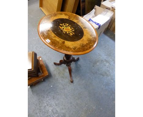 A VICTORIAN WALNUT OVAL WINE TABLE WITH CENTRAL EBONY PANEL MARQUETRIED WITH FLOWERS, THE GUN BARREL COLUMN FLARING TO A CARV