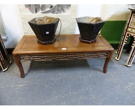 A CHINESE HARDWOOD LOW TABLE, THE RECTANGULAR TOP OVER AN OPENWORK SCROLL APRON AND SHAPED LEGS.   W 84 x D 35 x H 28cms.