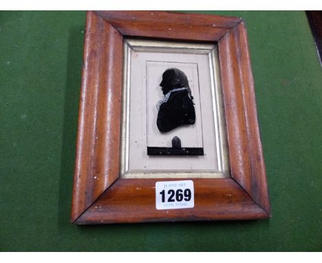A PORTRAIT SILHOUETTE, REVERSE PAINTED ON GLASS INSCRIBED THOMAS TOMPION 1710, MOUNTED IN A 19TH CENTURY MOULDED FRAME