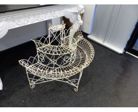 A WIRE WORK THREE TIER DEMILUNE PLANTER SUPPORTED ON THREE FEET.   W 97 x D 50 x H 81cms.