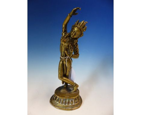 A TIBETAN POLISHED BRONZE FIGURE OF TARA DANCING WEARING A TIARA AND BEADED JEWELLERY.   H 20.5cms.