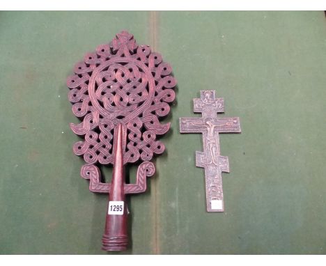 AN ETHIOPIAN COPTIC PIERCED AND CARVED WOODEN STAFF HEAD, THE NEVER ENDING KNOT SURMOUNTED BY A CROSS.    H 46cms. TOGETHER W