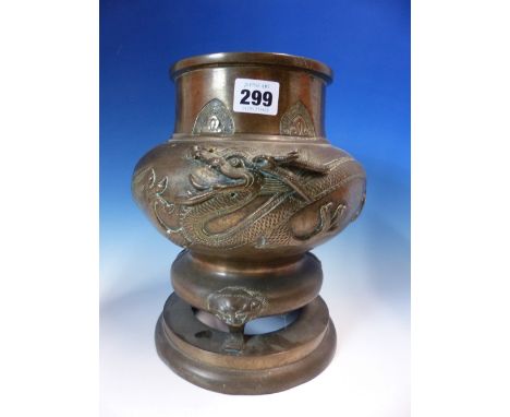 A  JAPANESE BRONZE INCENSE BURNER, THE SHORT NECK WITH LAPPETS ABOVE A BUN SHAPED BODY CAST WITH A DRAGON THE THREE MASK AND 