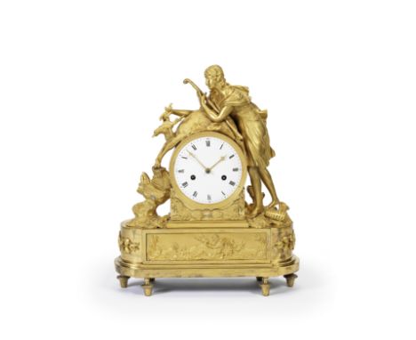 An early 19th century French ormolu mantel clockUnsignedThe case depicting a youth holding a stag by the antlers in one hand 