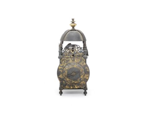 A mid 17th century lantern clockThe strapped bell surmounted by a later gilt brass knop, on cup-and-cover finials, tapering D