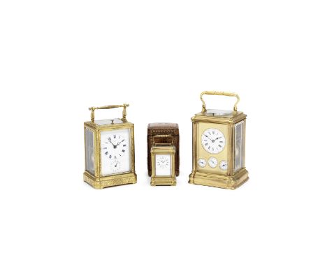 A rare late 19th century gilt brass gorge cased repeating carriage clock with subsidiary dials for alarm, date and day of the