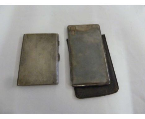 Two engine turned silver cigarette cases