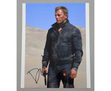 Revised Estimate - Daniel Craig, James Bond, full signature on 10 x 8 inch colour photograph.Provenance: Signed at UK premier