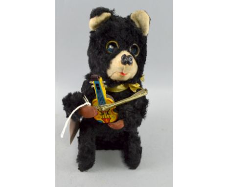 Japanese brown plush wind-up bear playing a violin circa 1950's,