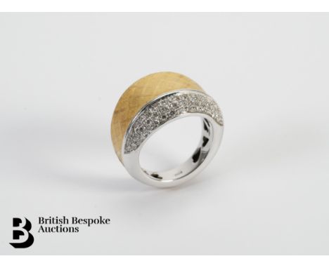 A bespoke Vendorafa 18ct yellow and white gold ring. The burnished ring having a lattice-work design heightened with 40 pts o