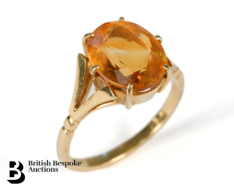 An 18ct yellow gold and citrine ring. The ring set with a citrine approx. 12 x 10mm, within a six-claw setting, size R, appro