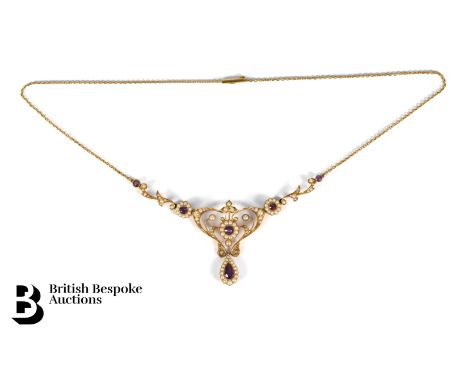 An Art Nouveau 14ct yellow gold amethyst and seed pearl necklace. The necklace composed of a garland of amethyst and seed pea