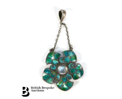 An Arts and Crafts silver and enamel floral pendant, approx 30mm, set with a cabochon moonstone, 7mm, approx weight 6.7 gms.&