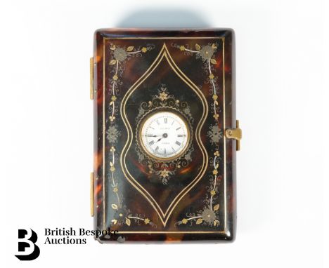 Tortoiseshell and gold card case, set with a Leroy Paris miniature clock and having an monogrammed cartouche, with silver and