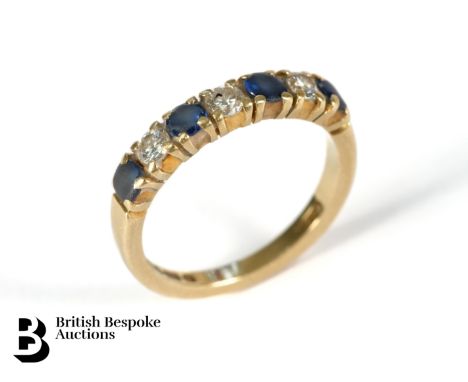 18ct yellow gold diamond and sapphire ring. The ring set with four 3mm sapphires (worn) and approx 21 pts of dias, size K, 2.