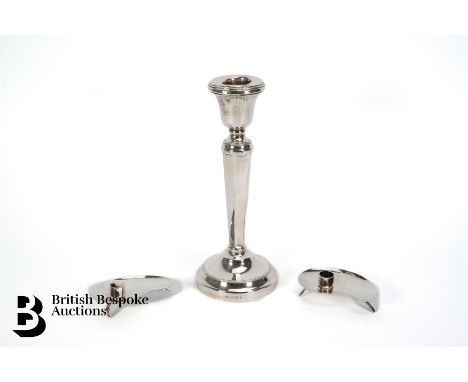A silver candlestick, Birmingham hallmark dated 1930, mm Henry Matthews, approx 18.5 cms h, 237.3 gms. This lot concludes wit