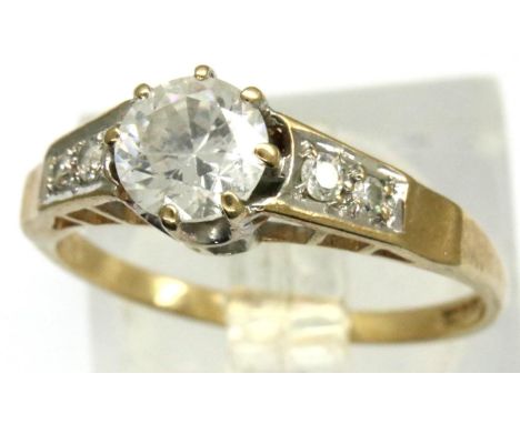 9ct gold solitaire ring with stone set shoulders, size N, 1.9g. P&amp;P Group 1 (£14+VAT for the first lot and £1+VAT for sub