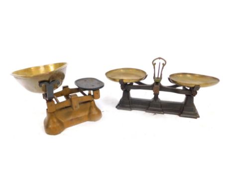 Two pairs of vintage postage scales, comprising one on a black and metal plate with brass circular foot, 30cm high, 51cm wide