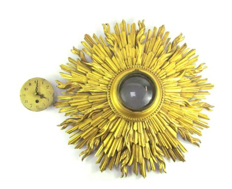 An early 20thC giltwood sunburst wall clock, with circular gold coloured enamel dial, with Arabic numerals, later quartz move