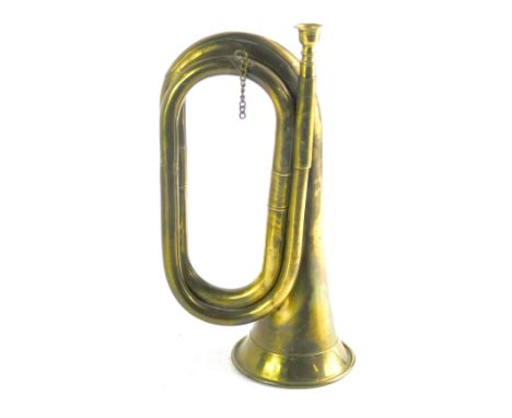 A brass bugle, of plain design, with mouth piece, 28cm. 