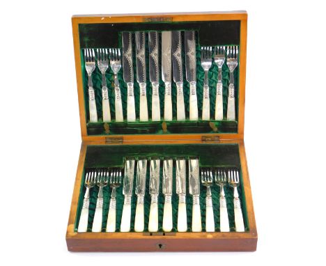 A late Victorian dessert knives and forks, comprising six pairs with engraved decorated and mother of pearl handles, in green
