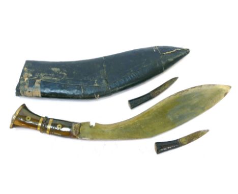 A Kukri knife, with a horn grip, with two additional knives, in leather scabbard, 44cm wide. 