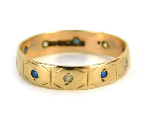 A sapphire and diamond eternity ring, set with round brilliant cut sapphire and diamonds, yellow metal, marked 9ct, ring size