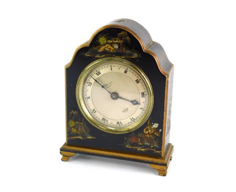 An early 20thC black Japanned cased Elliott mantel clock, the silvered Roman numeric circular dial bearing name for JW Benson