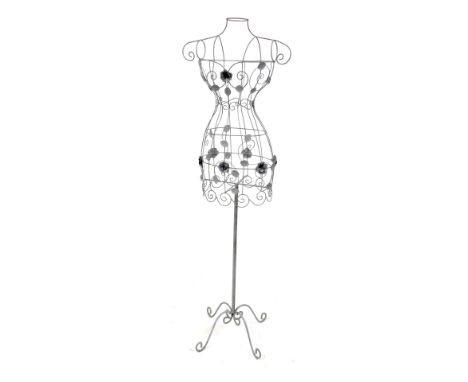 A painted wire frame decorative mannequin stand, decorated with flower heads and foliage, 152cm high.