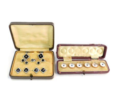 Two cased sets of Art Deco style collar studs, comprising one with mother of pearl and blue paste stone set rings, yellow met