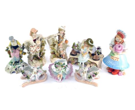 A group of 20thC Continental porcelain, to include a pair of KMP spill vases, modelled as a young girl with tambourine, and b