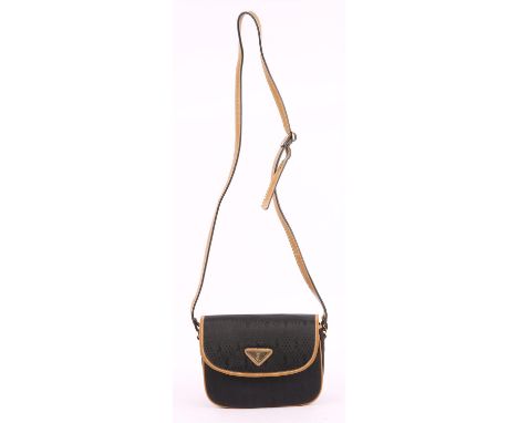 YVES SAINT LAURENT Vintage 1980s/1990s YSL embossed black and tan canvas and leather small cross-body handbag. Leather interi