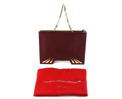 GEORGE ANGELOPOULOS burgundy leather rigid square handbag with gold coloured hardware and black canvas lining. Made in Italy.