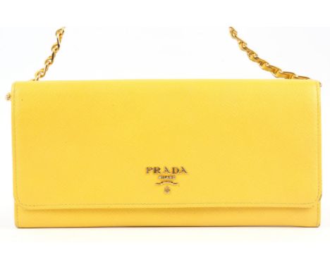 PRADA. A saffiano wallet on chain (WOC) with gold coloured hardware (GCH) in bright yellow leather  (H12cm x W21cm x D3cm)Con